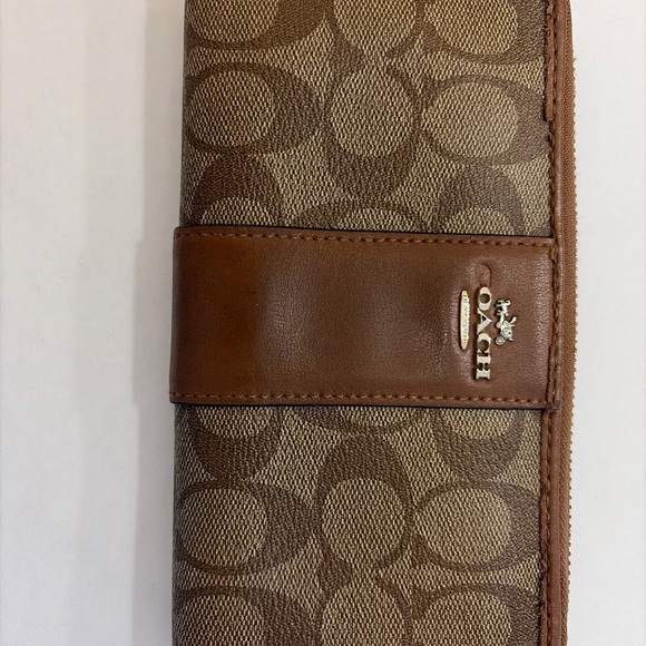 Coach Tan and Brown Signature Zip Wallet
PROJECT - Picture 3 of 9